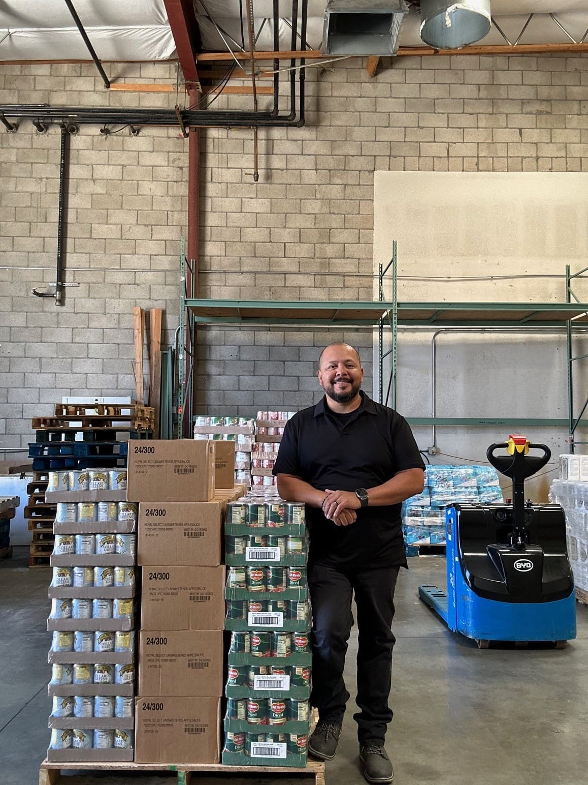 smiling man in warehouse